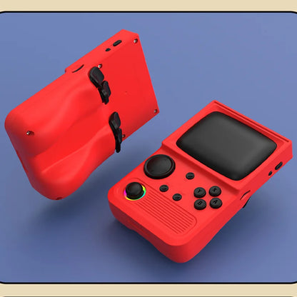 Red handheld gaming console with black screen and buttons on a blue surface