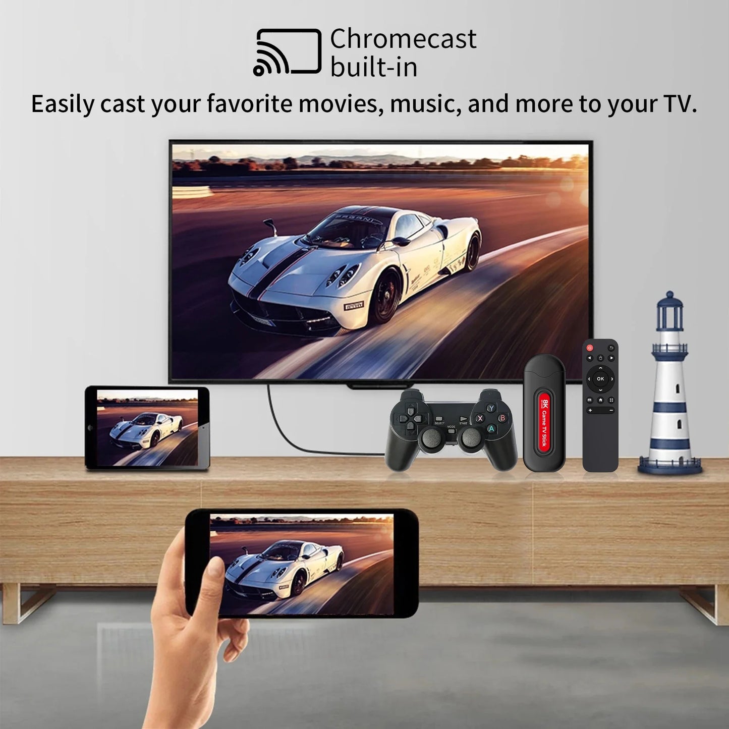 Smart TV displaying a car on screen with a smartphone, gaming controller, and remote control on a wooden stand.