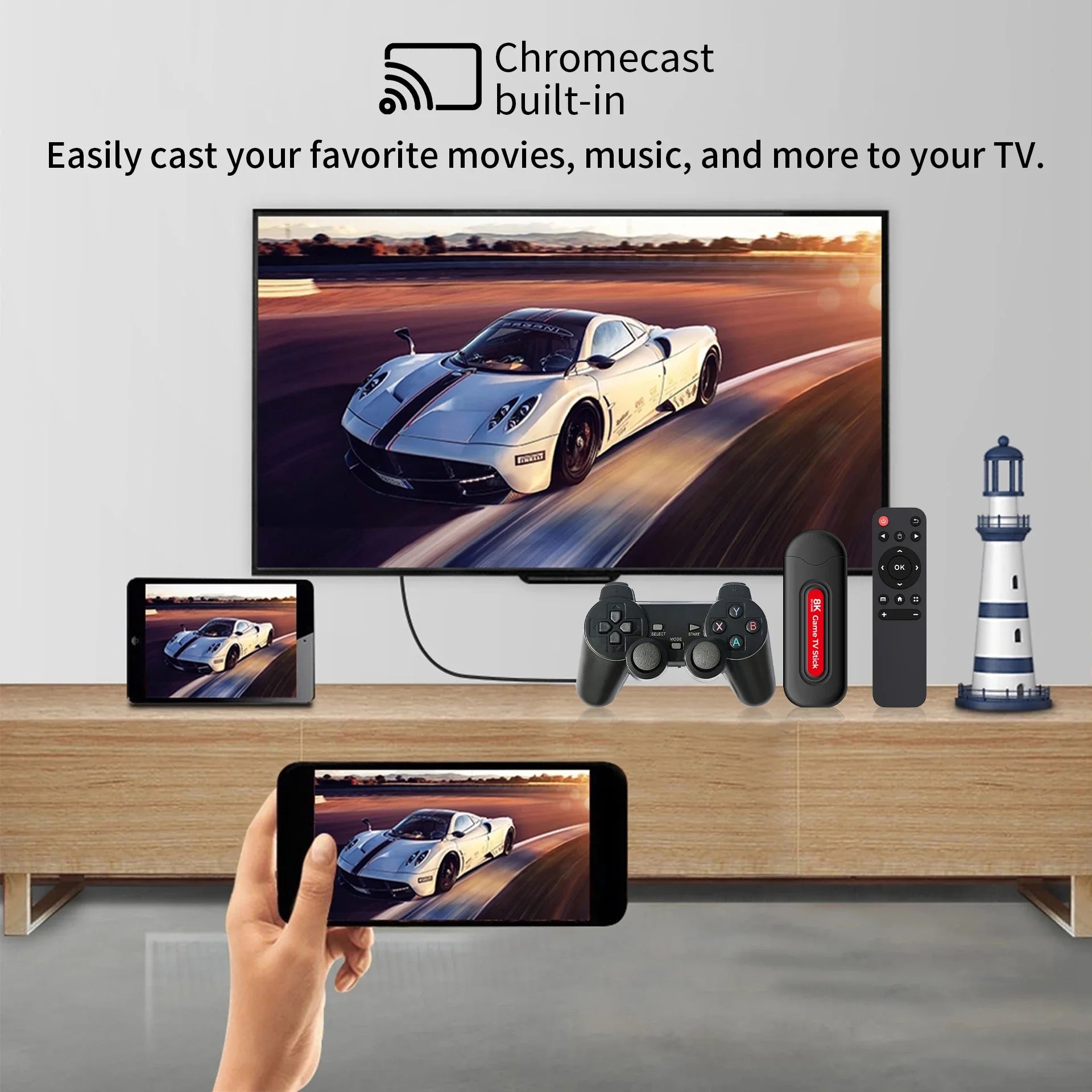 Smart TV displaying a car on screen with a smartphone, gaming controller, and remote control on a wooden stand.